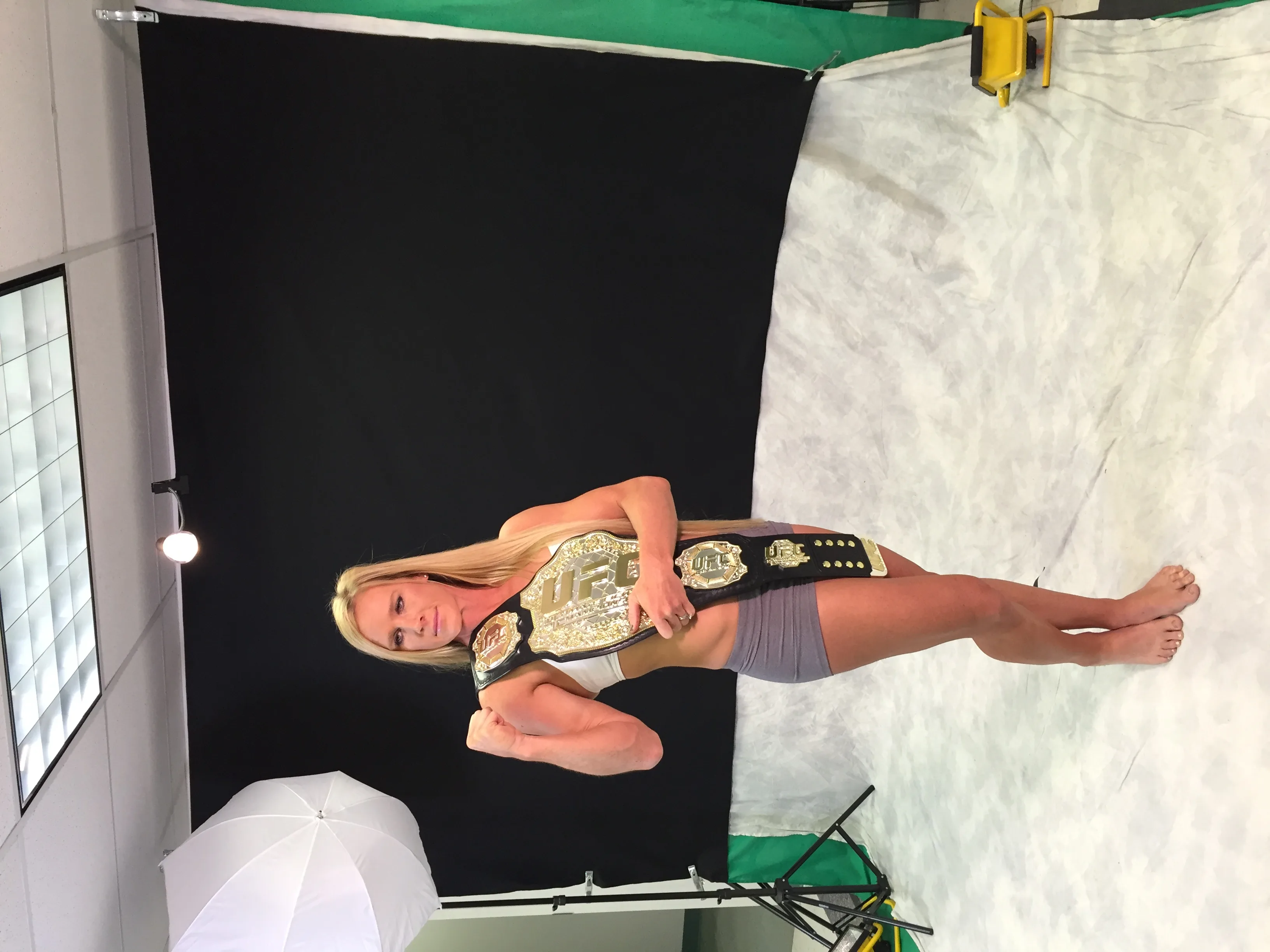Holly Holm with the UFC championship belt — celebration